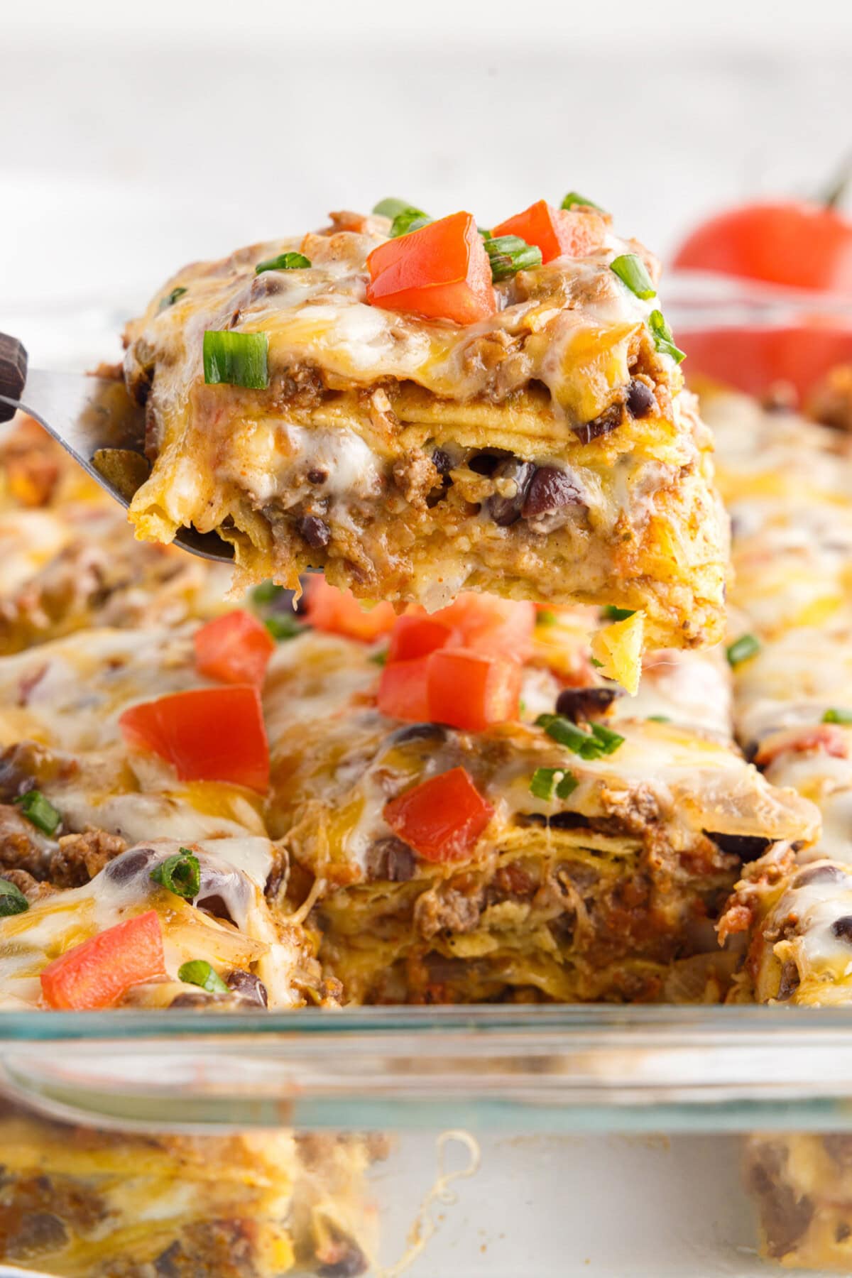 Piece of Mexican Lasagna on a spatula 