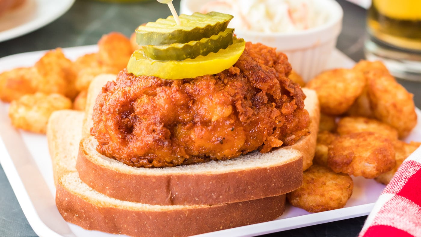 Nashville hot chicken is easy to make at home. Give your chicken a good dredge and transfer to a ski