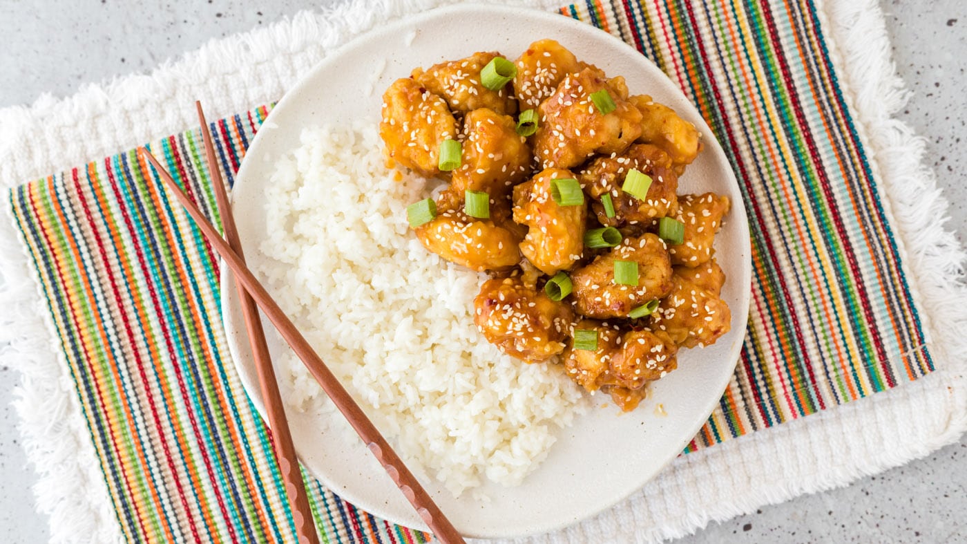 This tangy and sticky orange chicken recipe is just like your favorite takeout, and it only takes 30