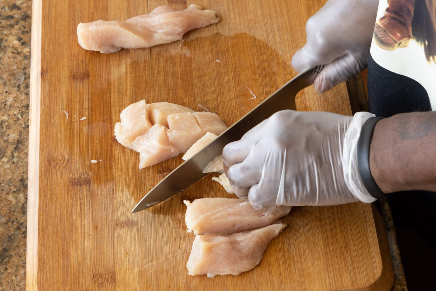 chopping chicken with a chef knife