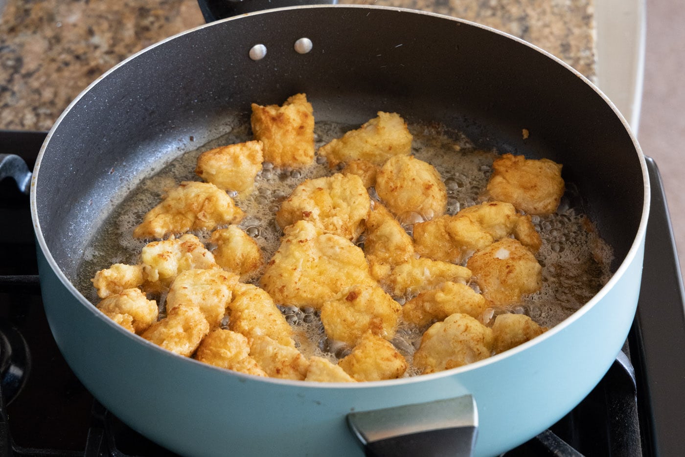 fried chopped chicken in a skillet