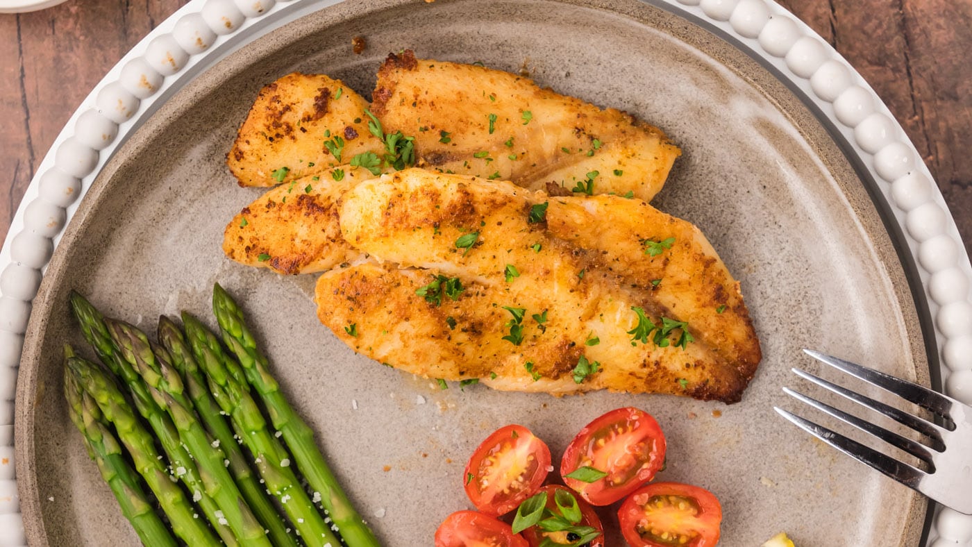 Golden, flakey orange roughy is incredibly easy to make with a bit of butter and Old Bay seasoning.