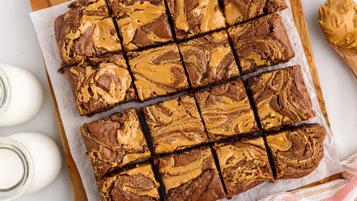 Peanut butter brownies begin with a classic fudgy brownie base that's decked out with a marbled pean