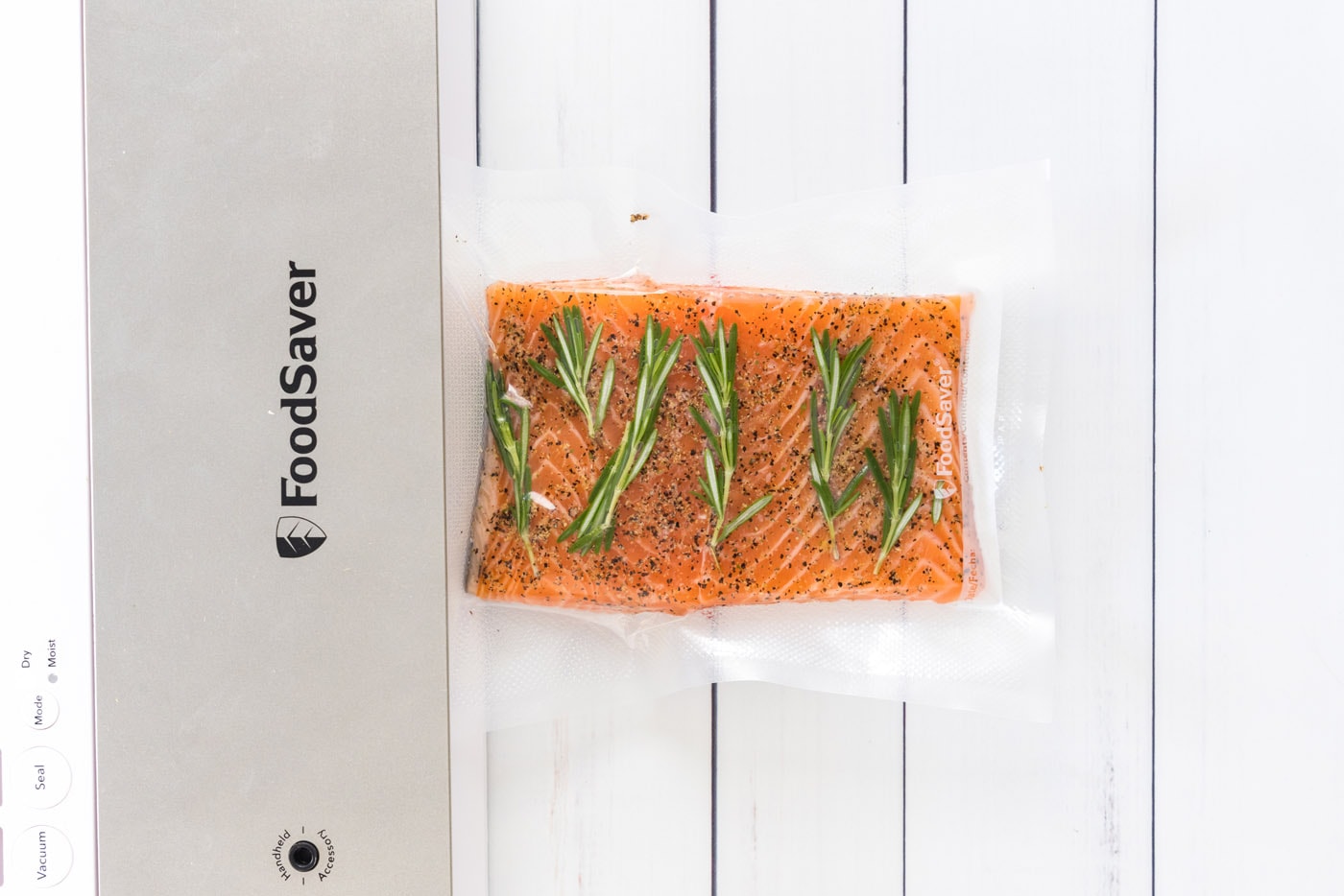 vacuum sealed salmon filets and herbs
