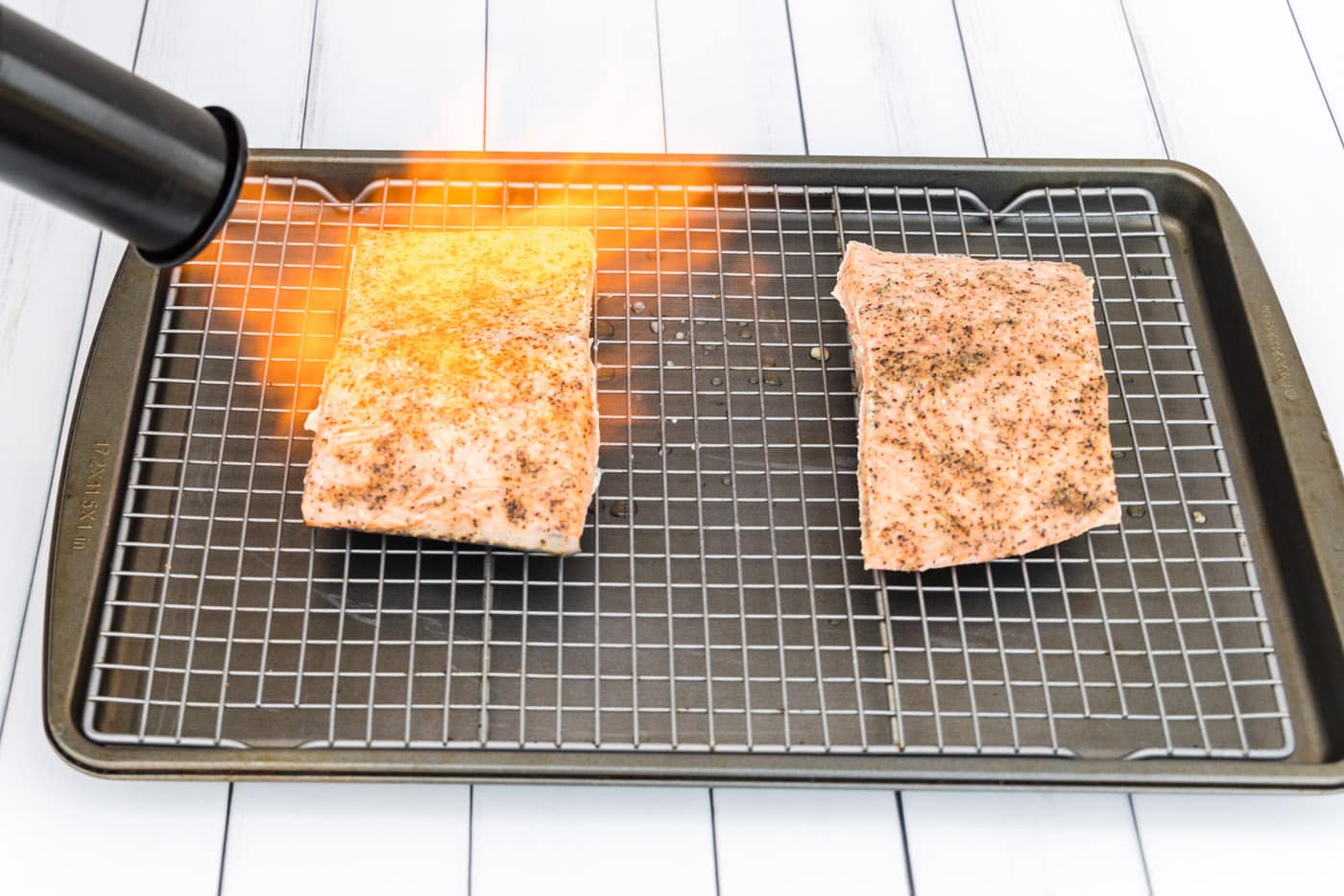 searing salmon filets with a kitchen torch