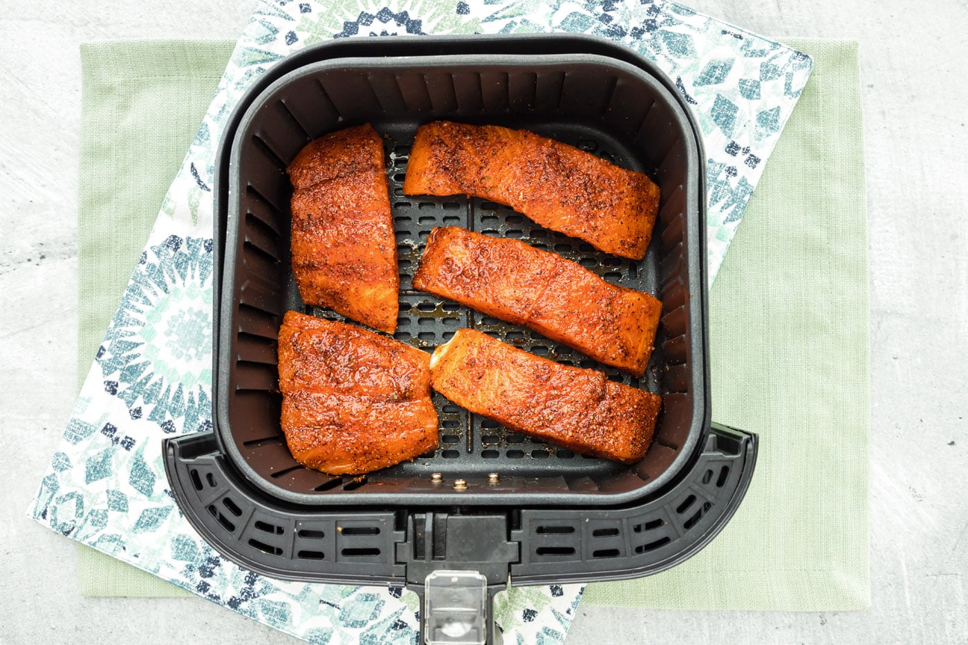 salmon filtes in an air fryer basket
