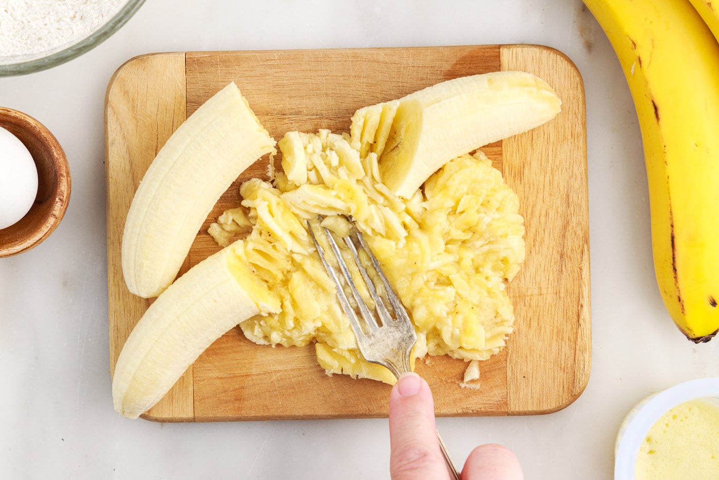 mashing ripe bananas with a fork