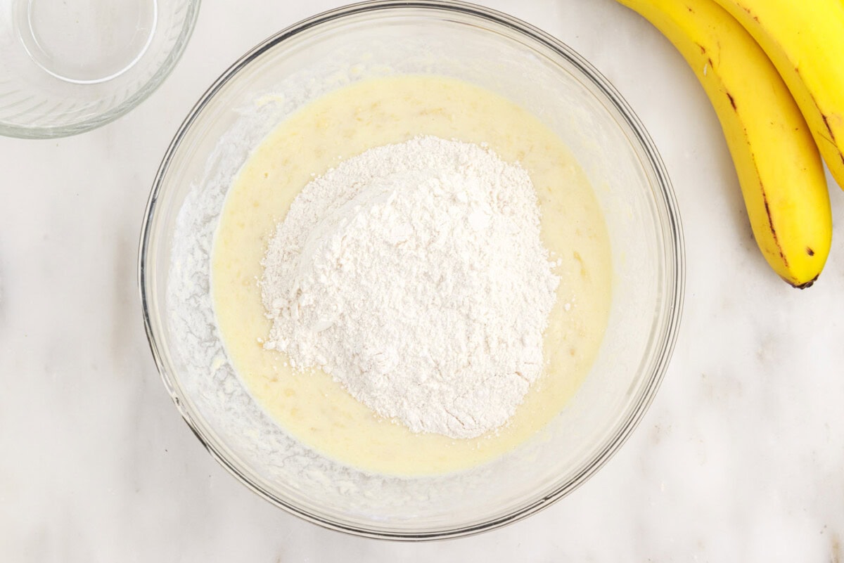 adding dry ingredients to pancake batter