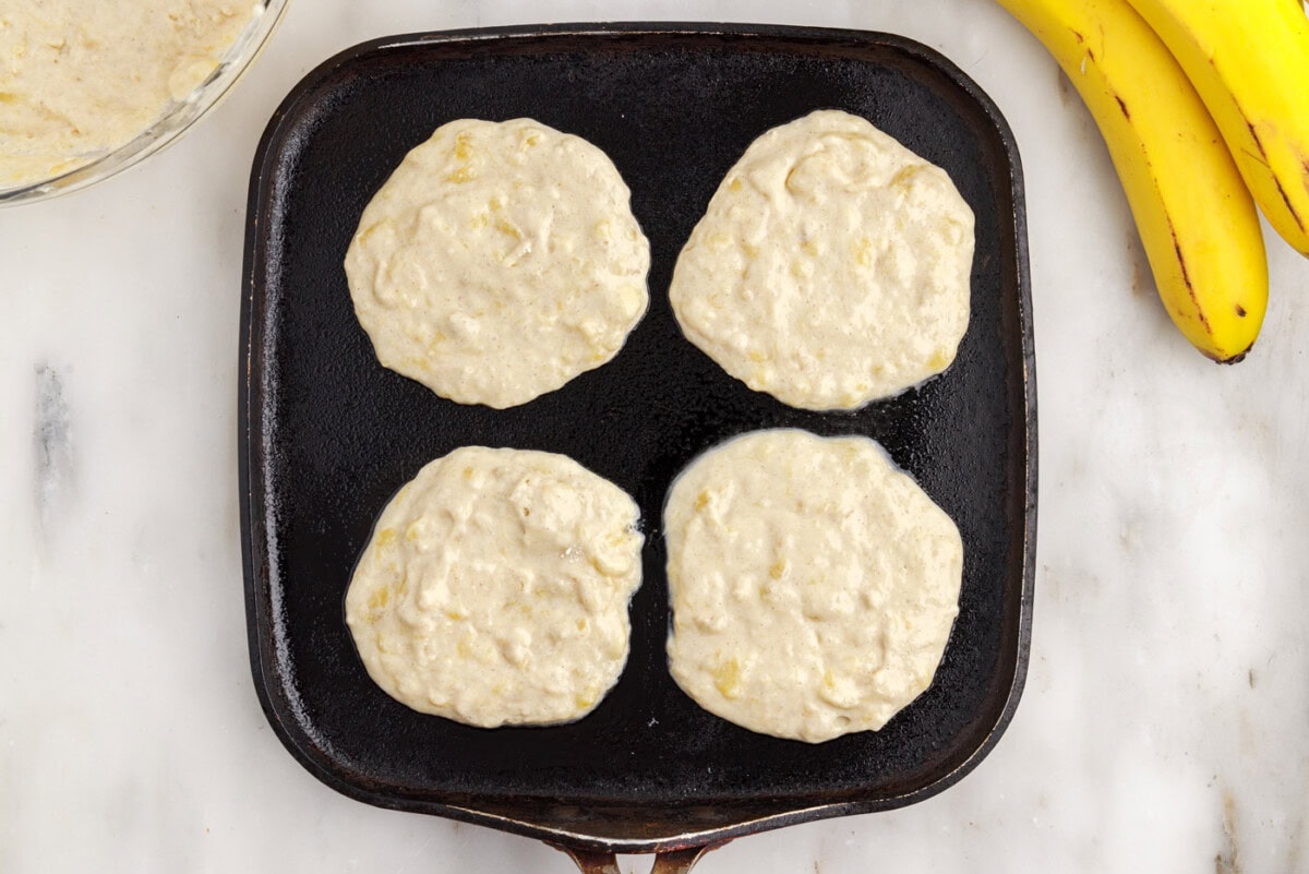 banana pancake batter on a griddle
