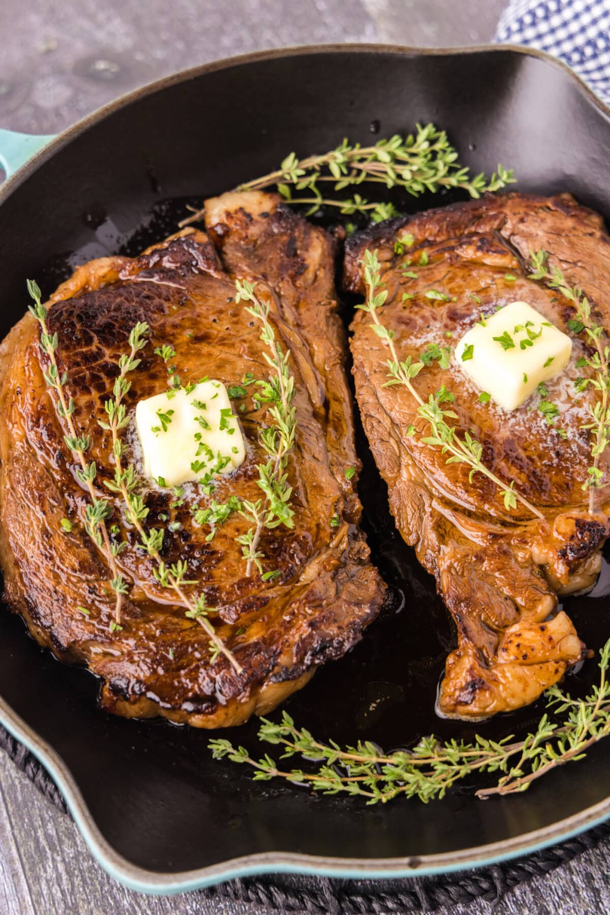 Two Cast Iron Ribeyes in a cast iron pan