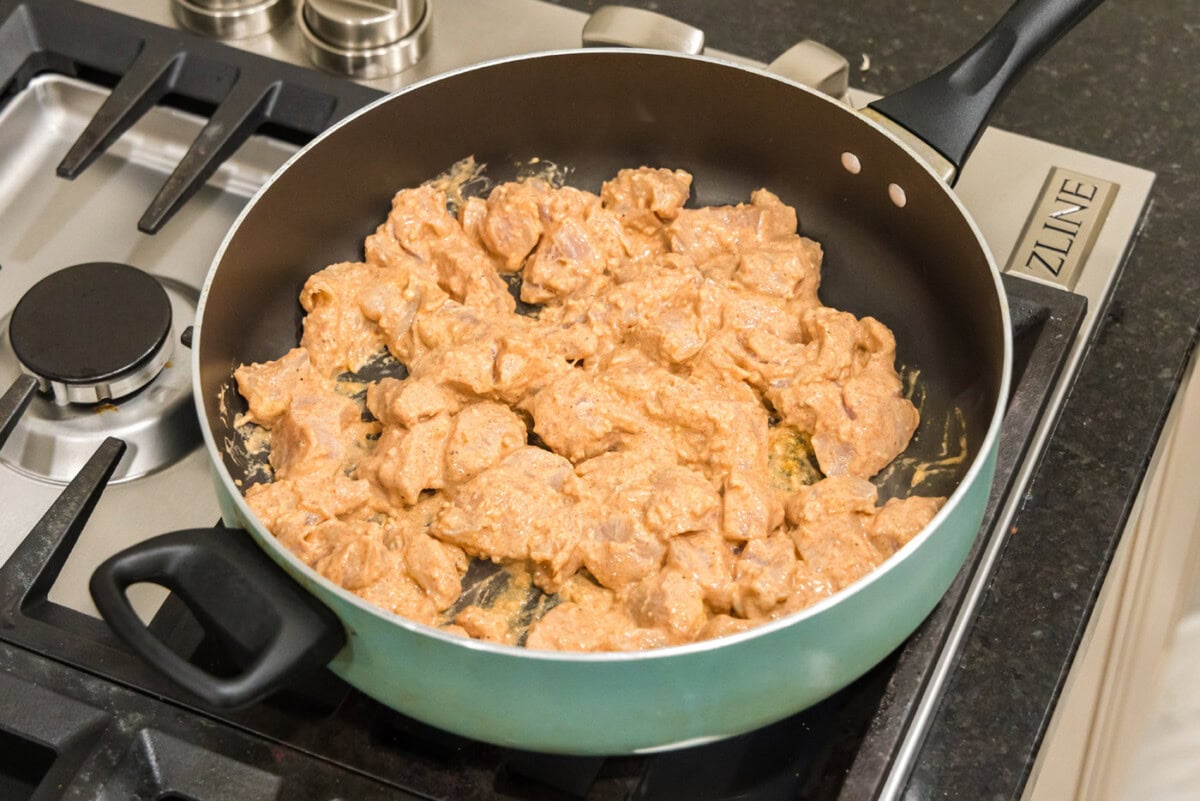 marinated chicken in a skillet