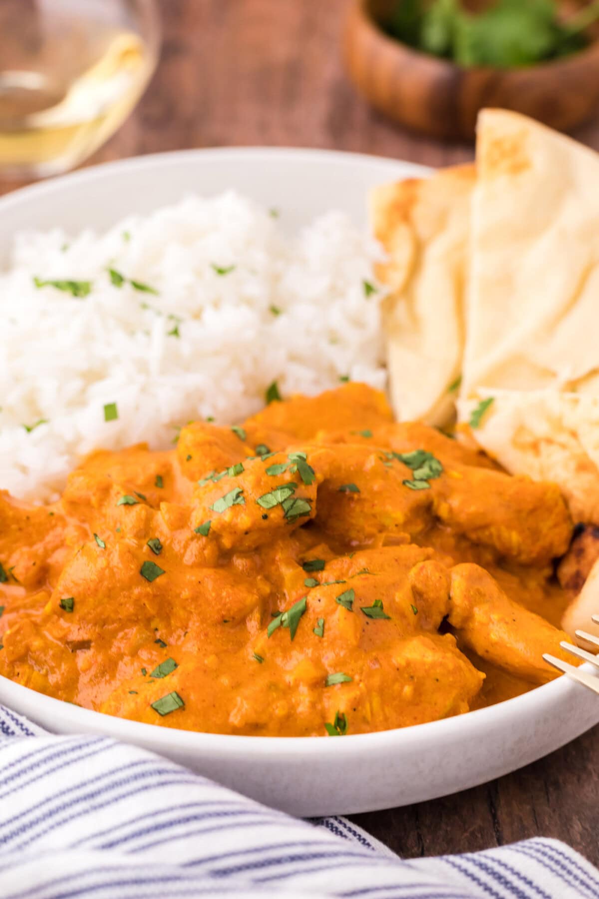 Close up of a bowl of Chicken Tikka Masala with rice