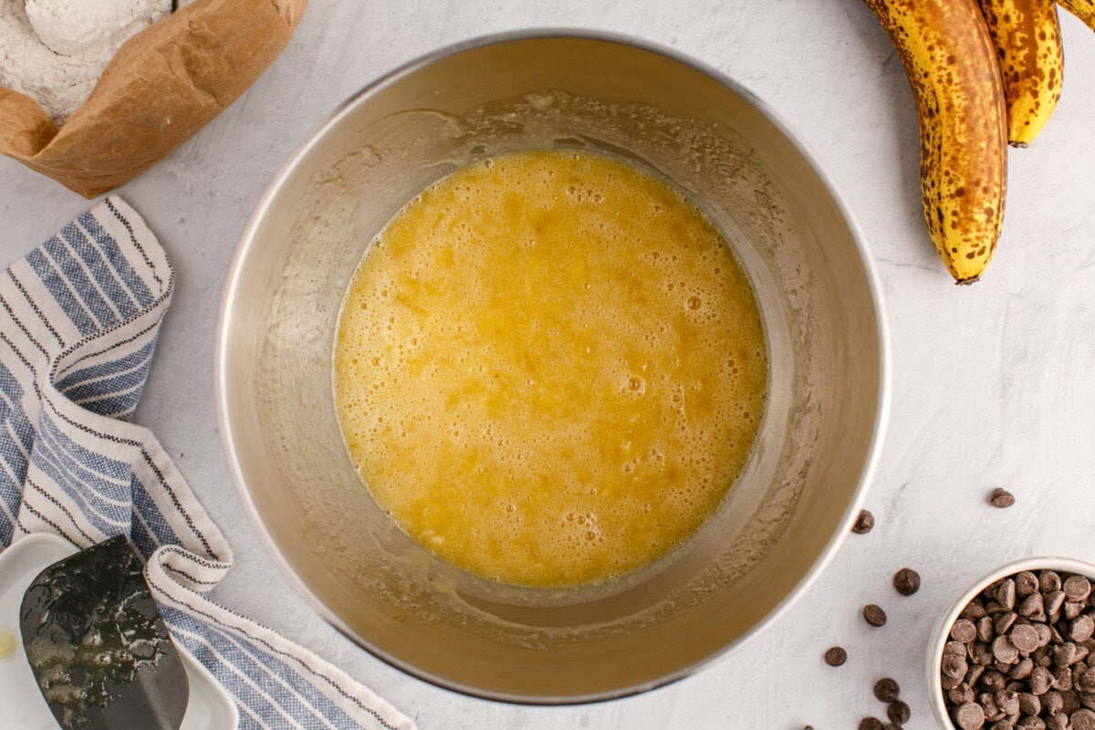 wet ingredients for banana bread in a stand mixer bowl