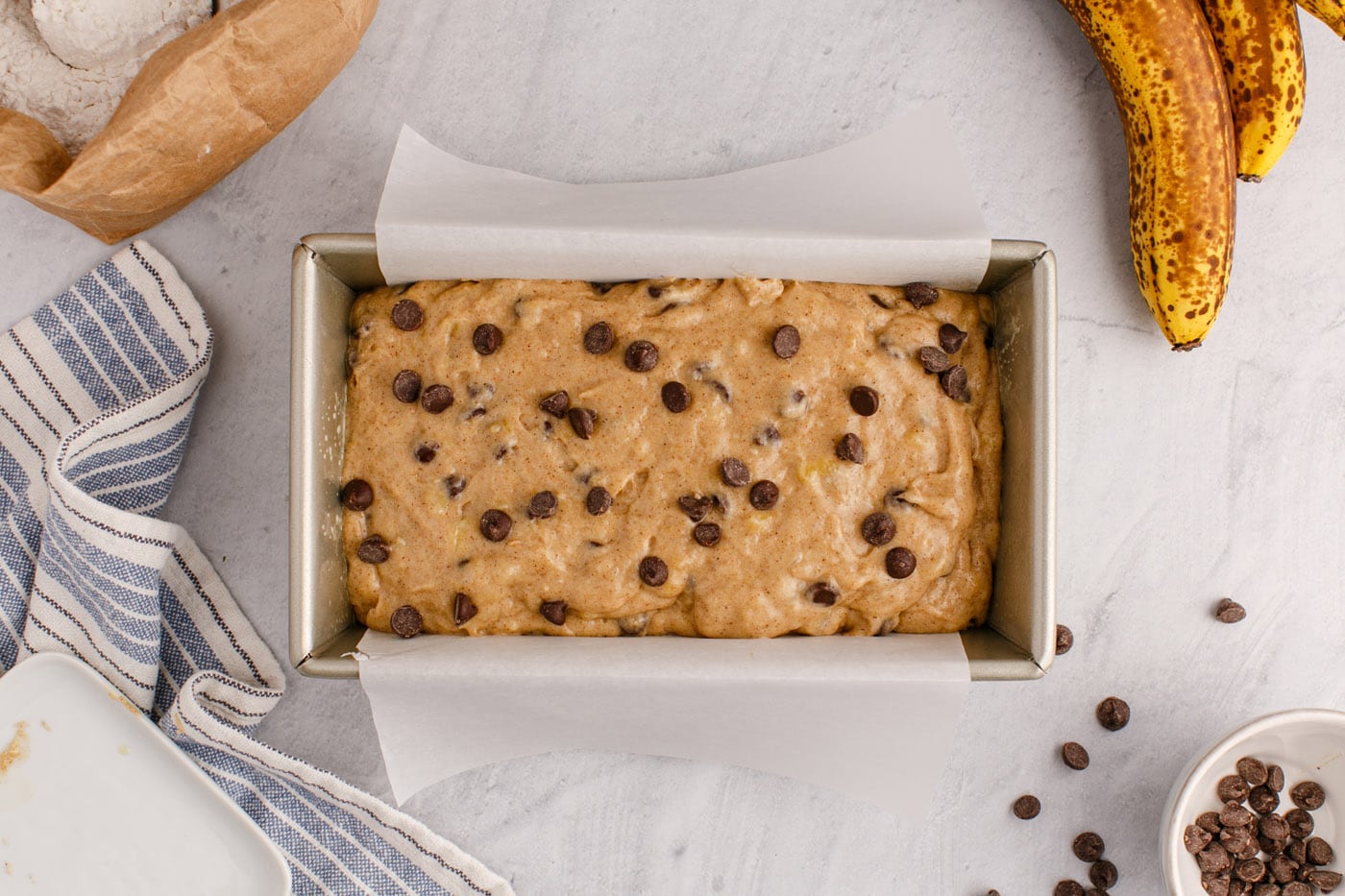 chocolate chip banana bread batter in a loaf pan