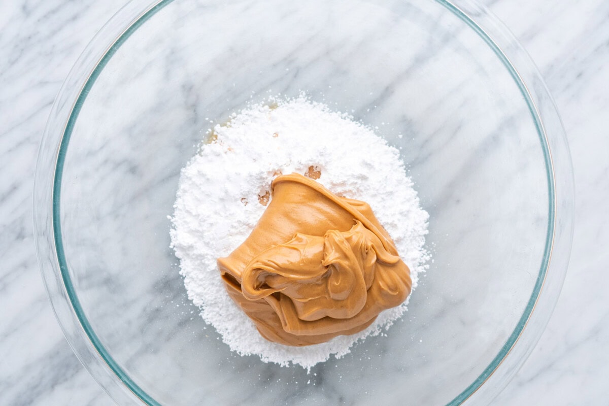 powdered sugar, vanilla, salt, and peanut butter in a bowl