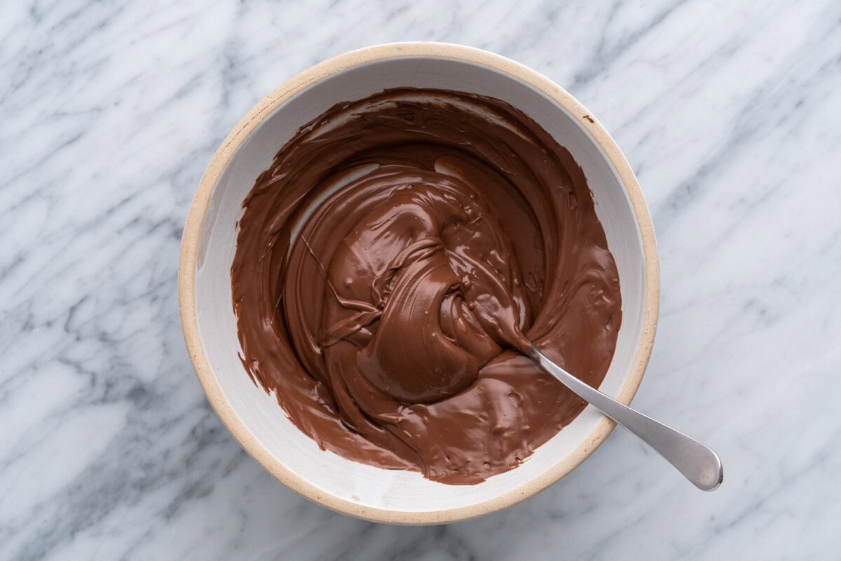 melted chocolate in a bowl with a spoon