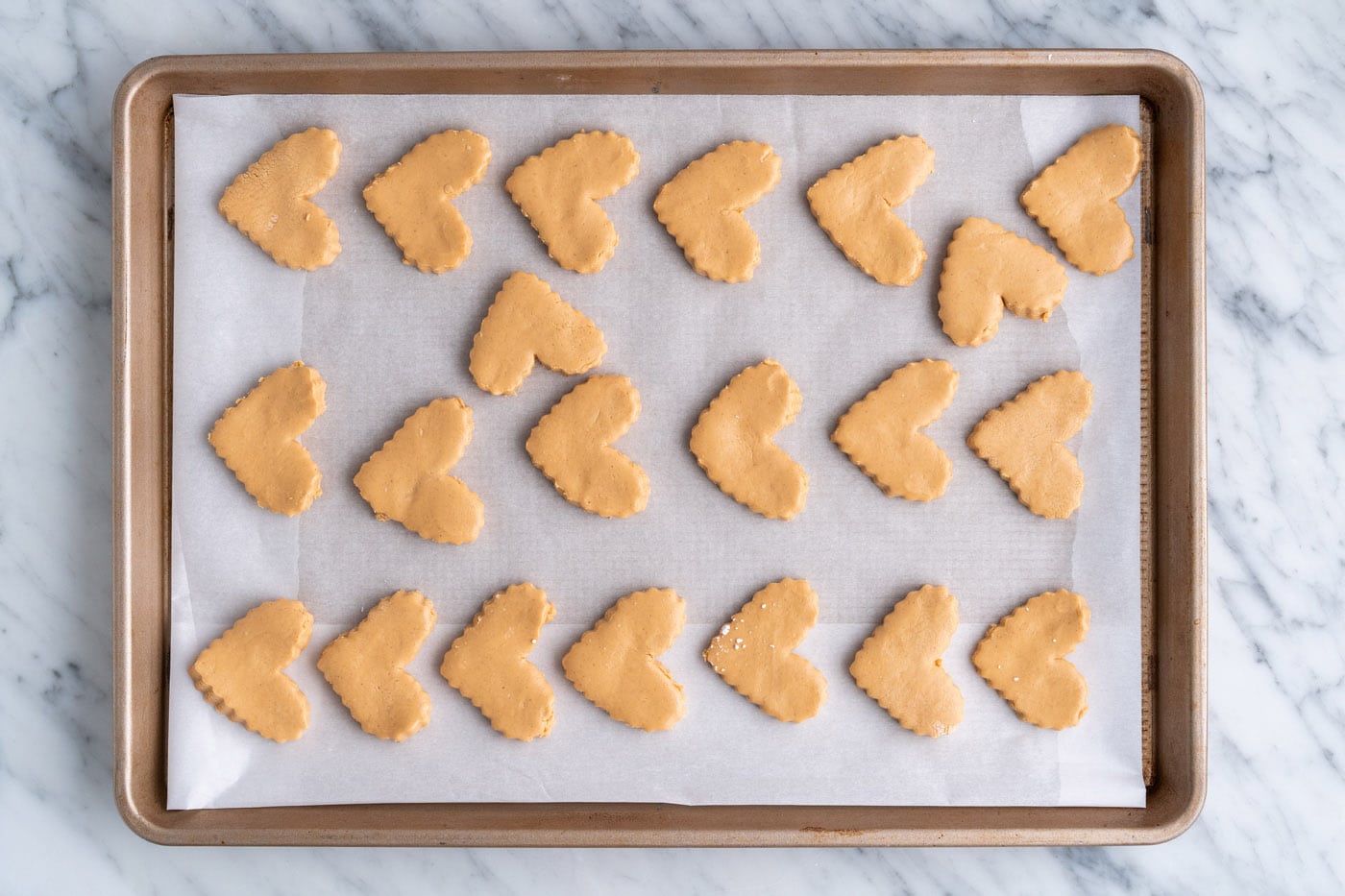 heart shaped peanut butter bars on a baking sheet