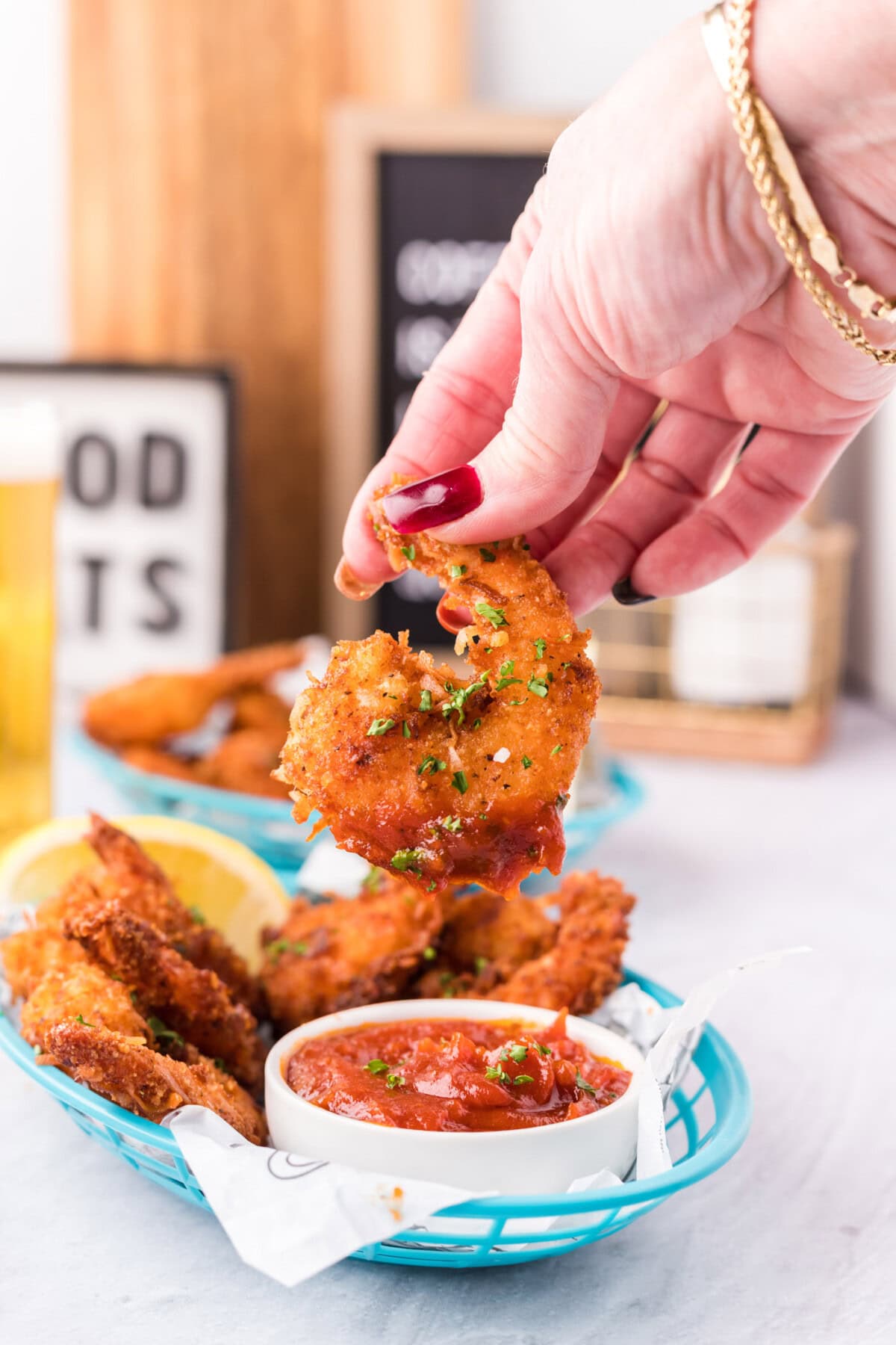 Coconut Shrimp dipped in cocktail sauce