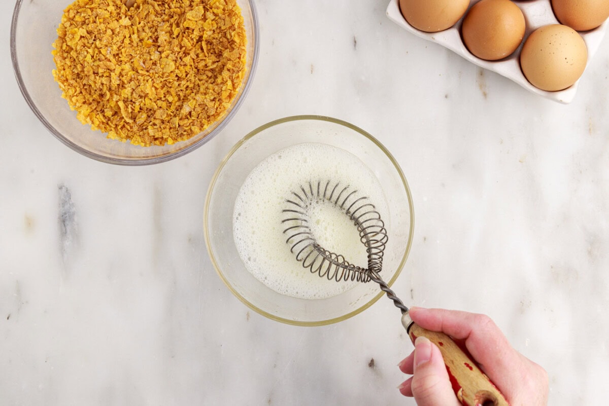 frothing egg whites in a bowl