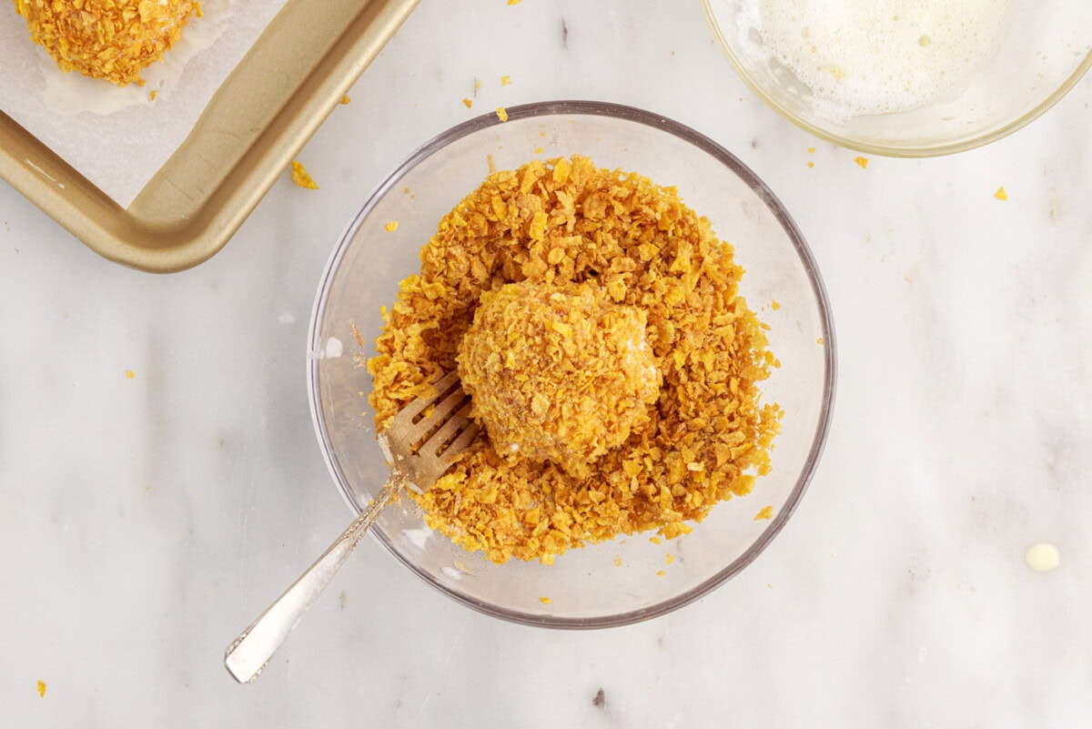 coating ice cream ball in cornflake mixture