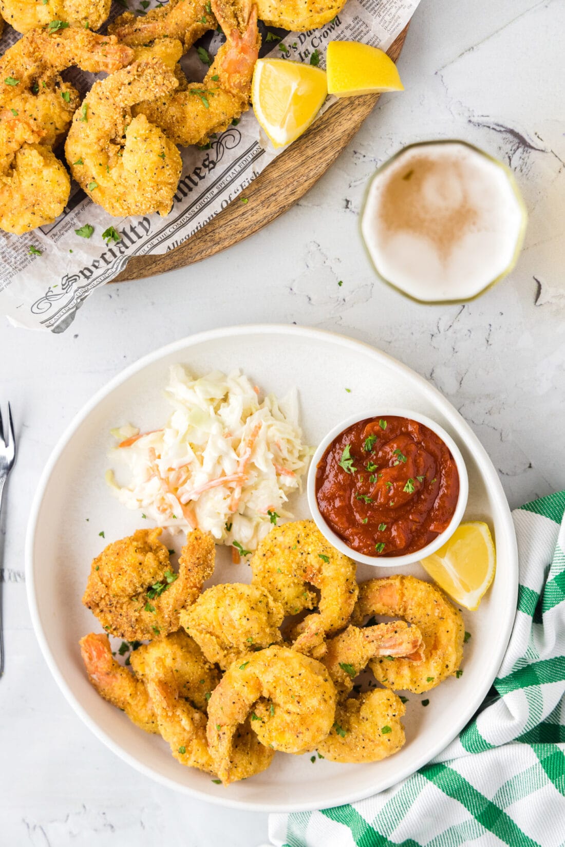 Plate of Fried Shrimp with a bowl of cocktail sauce and coleslaw 