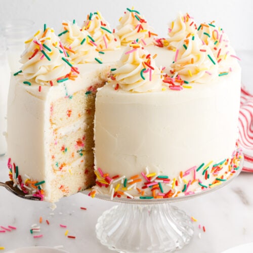Funfetti Cake with a slice being removed