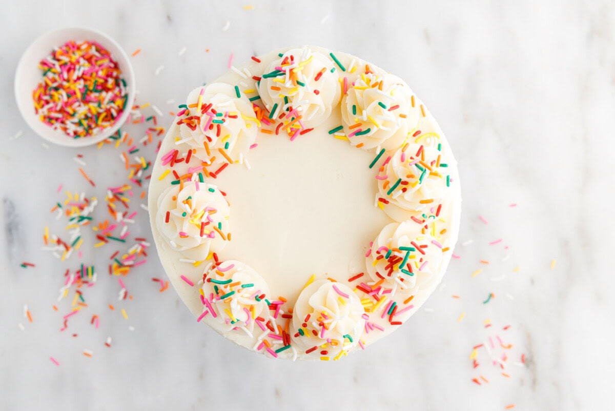 funfetti cake with piped frosting and sprinkles