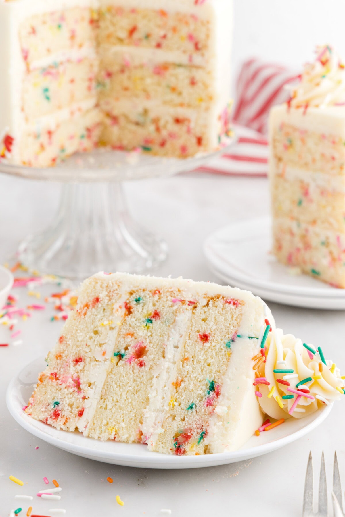 Slice of Funfetti Cake on a plate