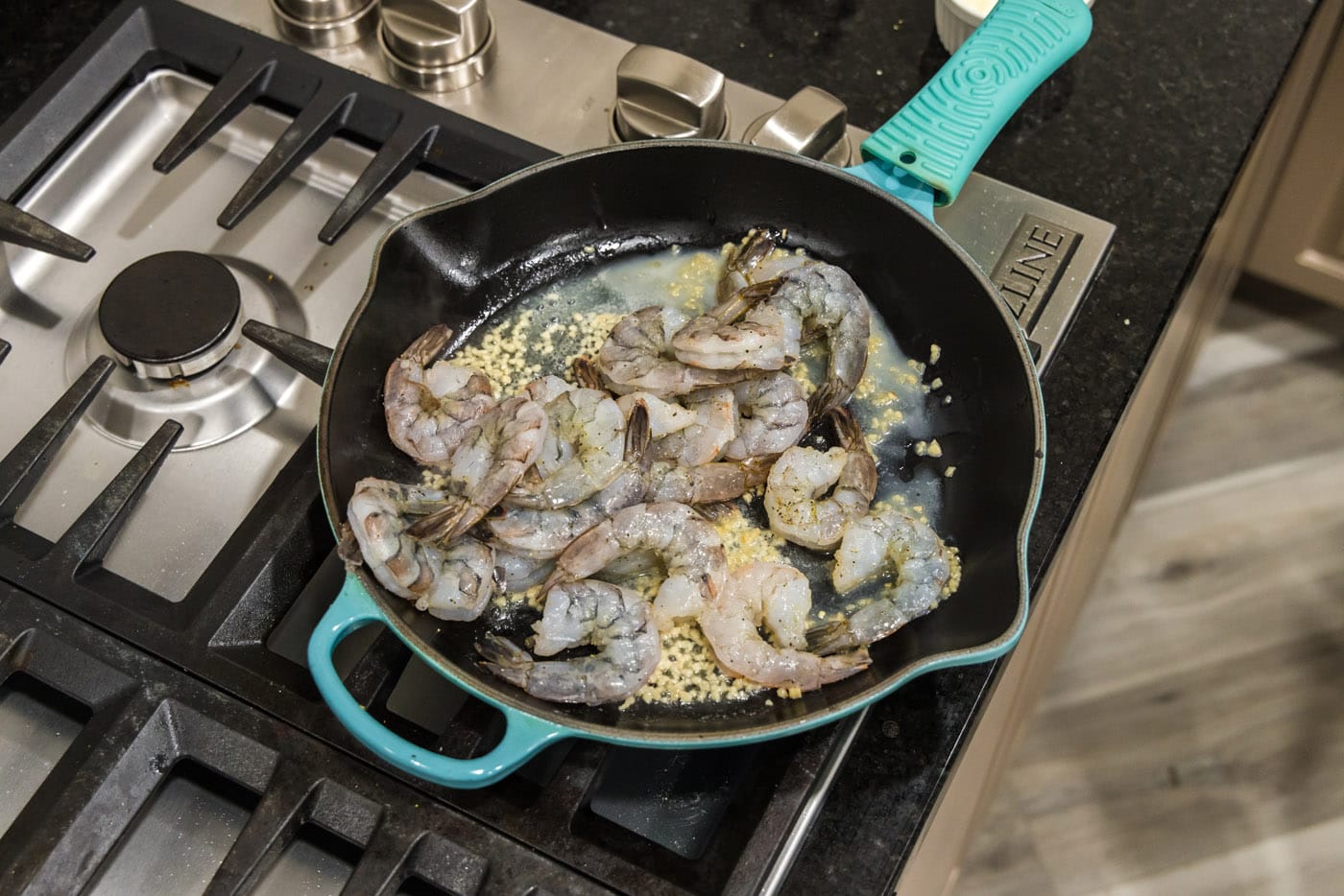 seasoned shrimp in a skillet with butter and garlic