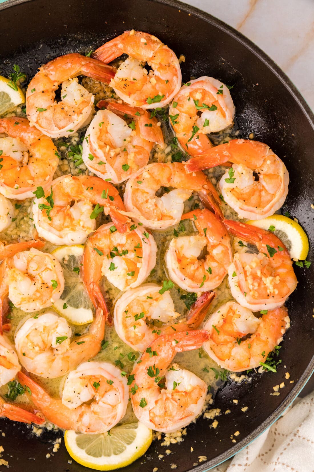 Close up overhead photo of Garlic Butter Shrimp in a skillet