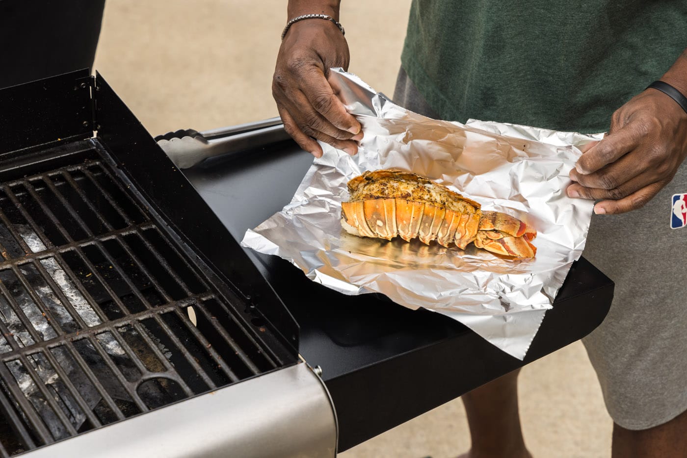 wrapping grilled lobster tail in aluminum foil