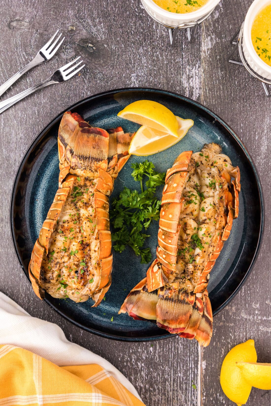 Two Grilled Lobster Tails on a plate 