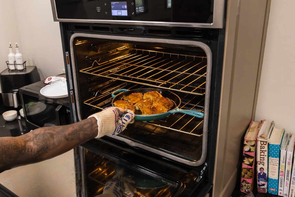 putting honey garlic chicken thighs into the oven