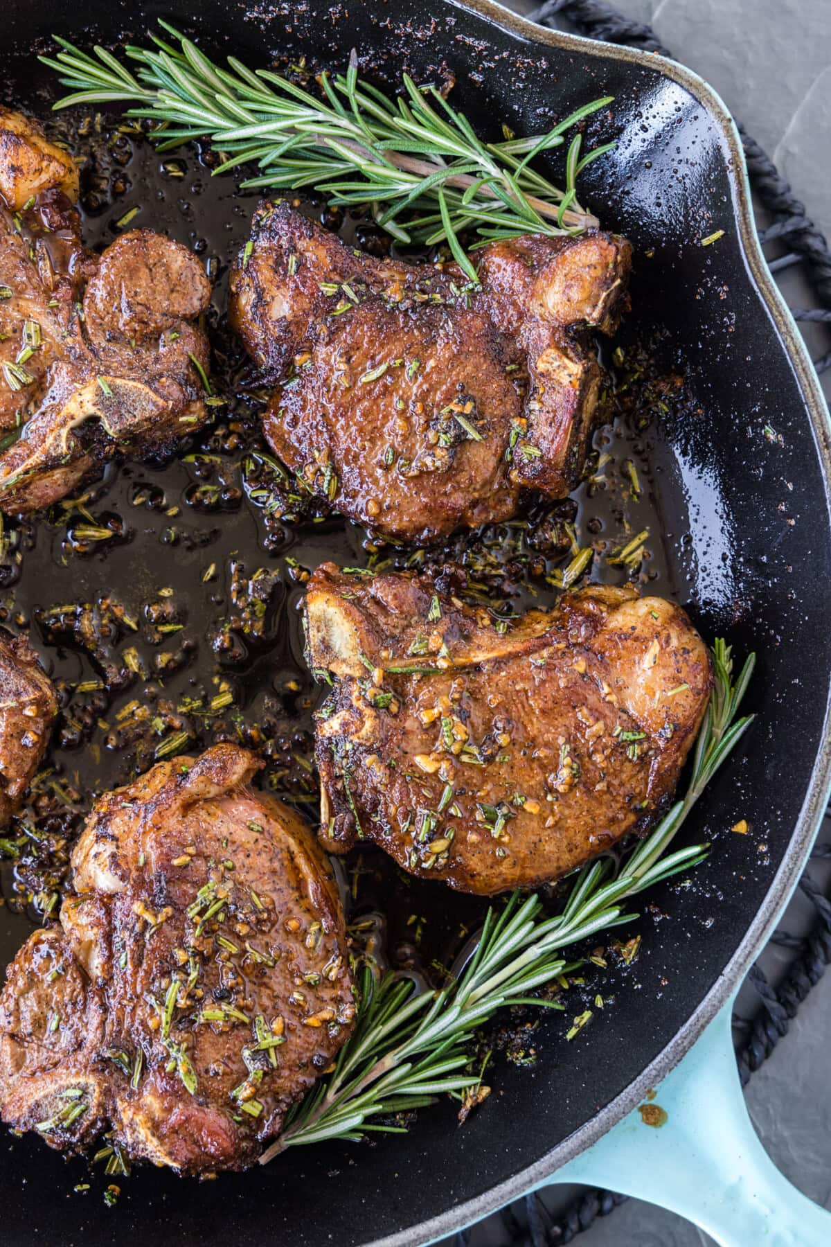 Close up of a skillet of Lamb Loin Chops