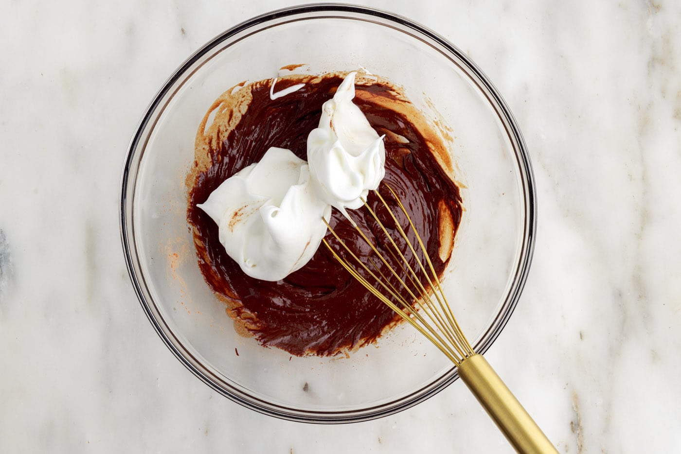 combining whipped egg whites and chocolate batter with a whisk