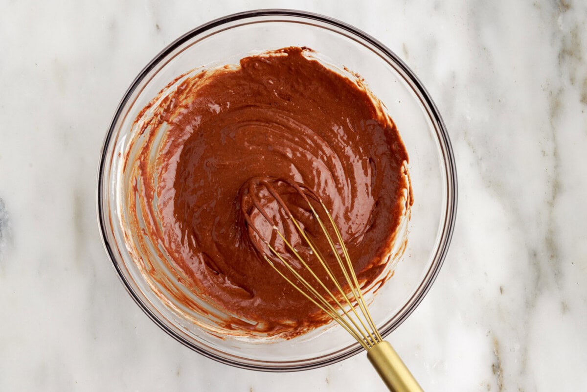 molten lava cake batter in a bowl with a whisk