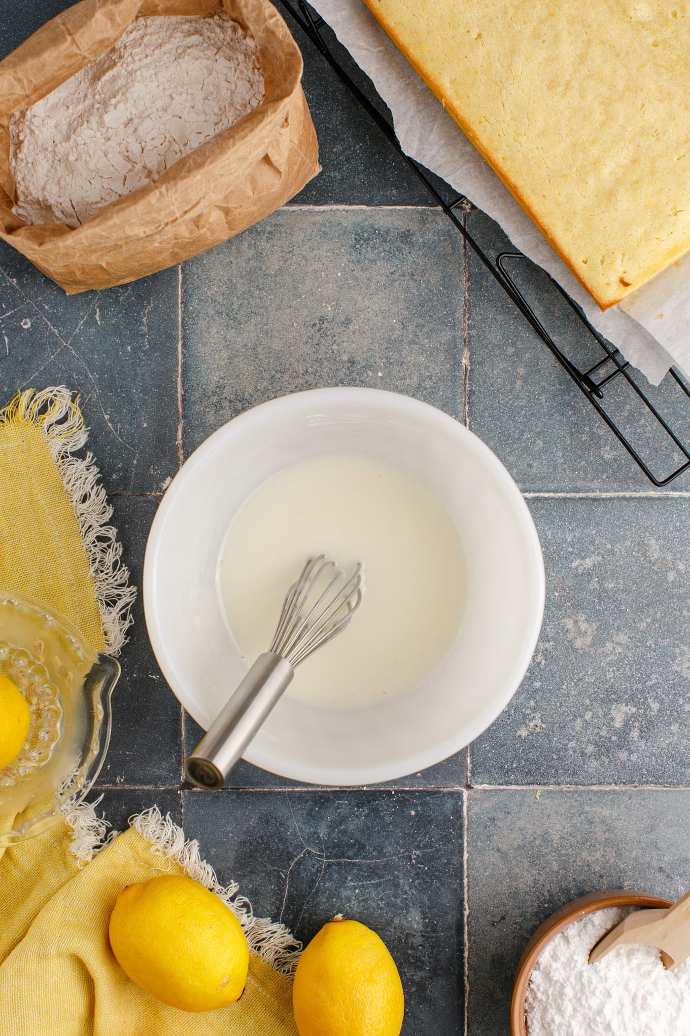 easy lemon glaze in a small mixing bowl with whisk