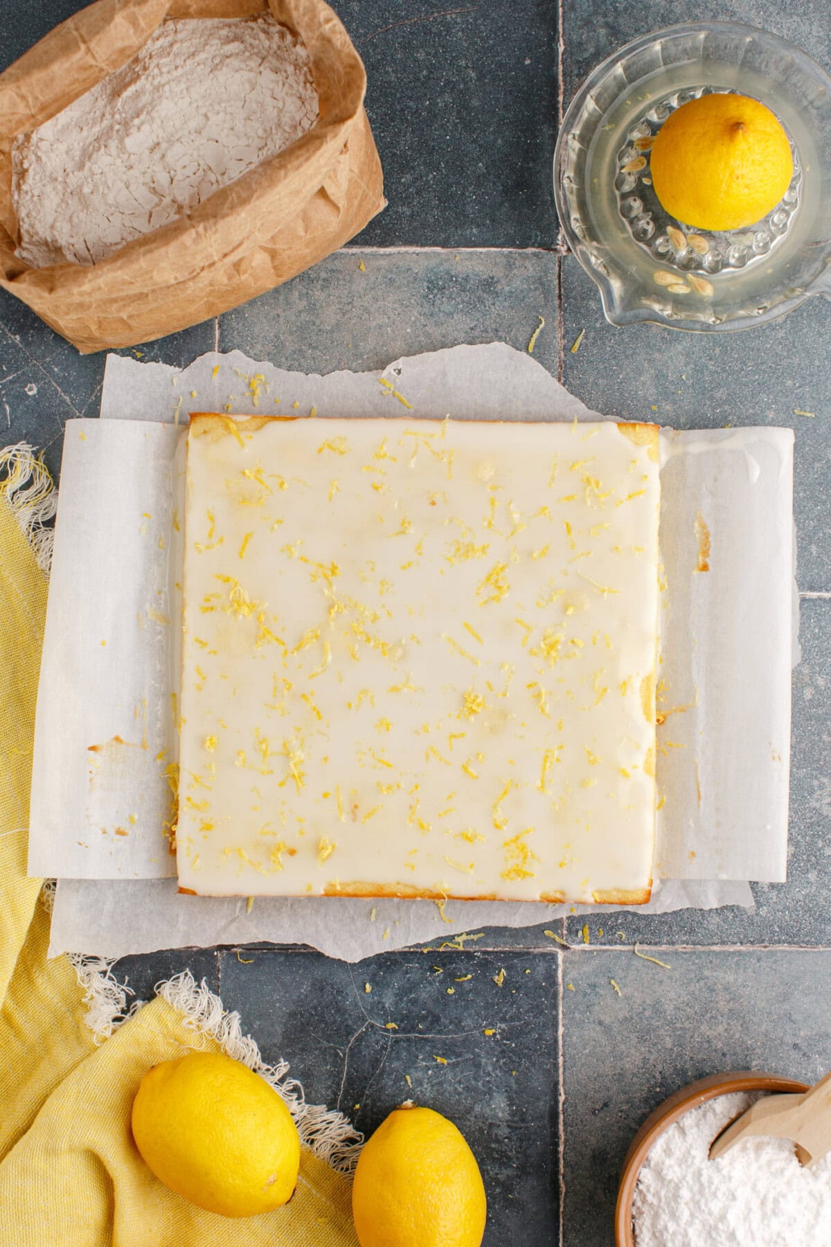 overhead of lemon glazed brownies with lemon zest