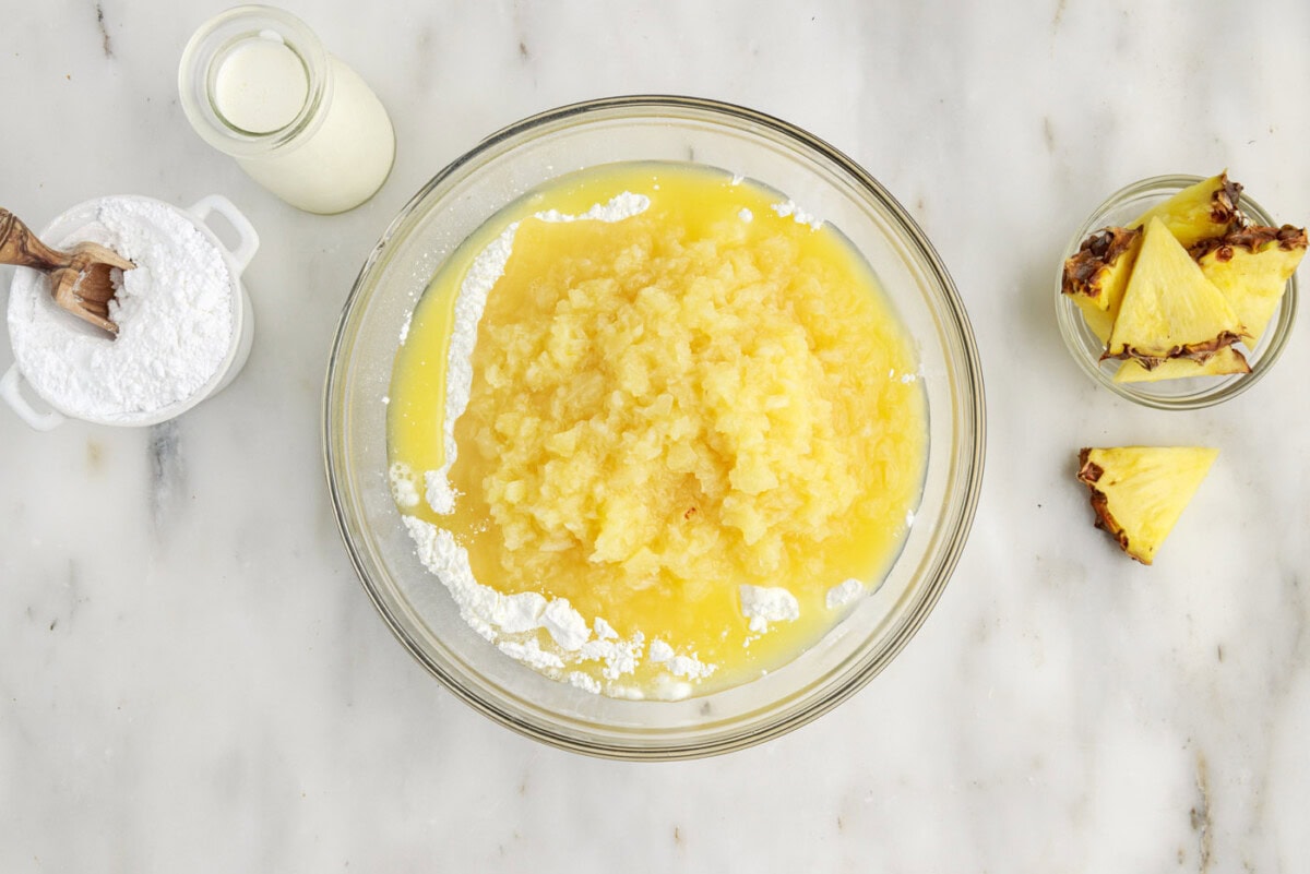 crushed pineapple and angel food cake mix in a bowl