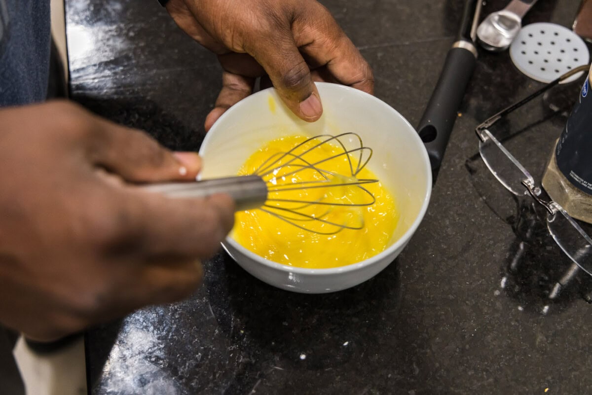 whisking eggs in a bowl