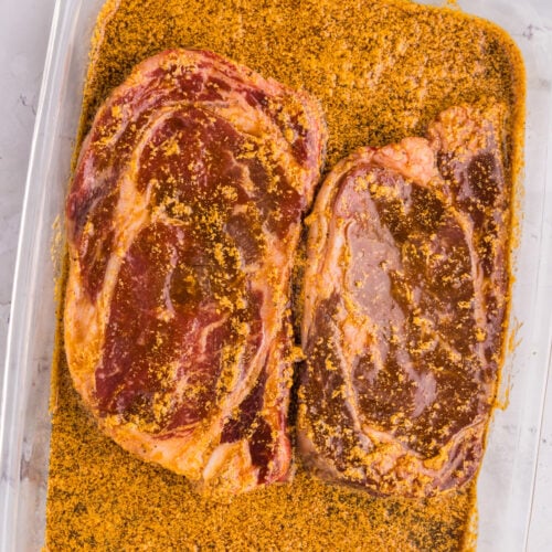 Ribeye Steak Marinade in a glass dish with two ribeyes