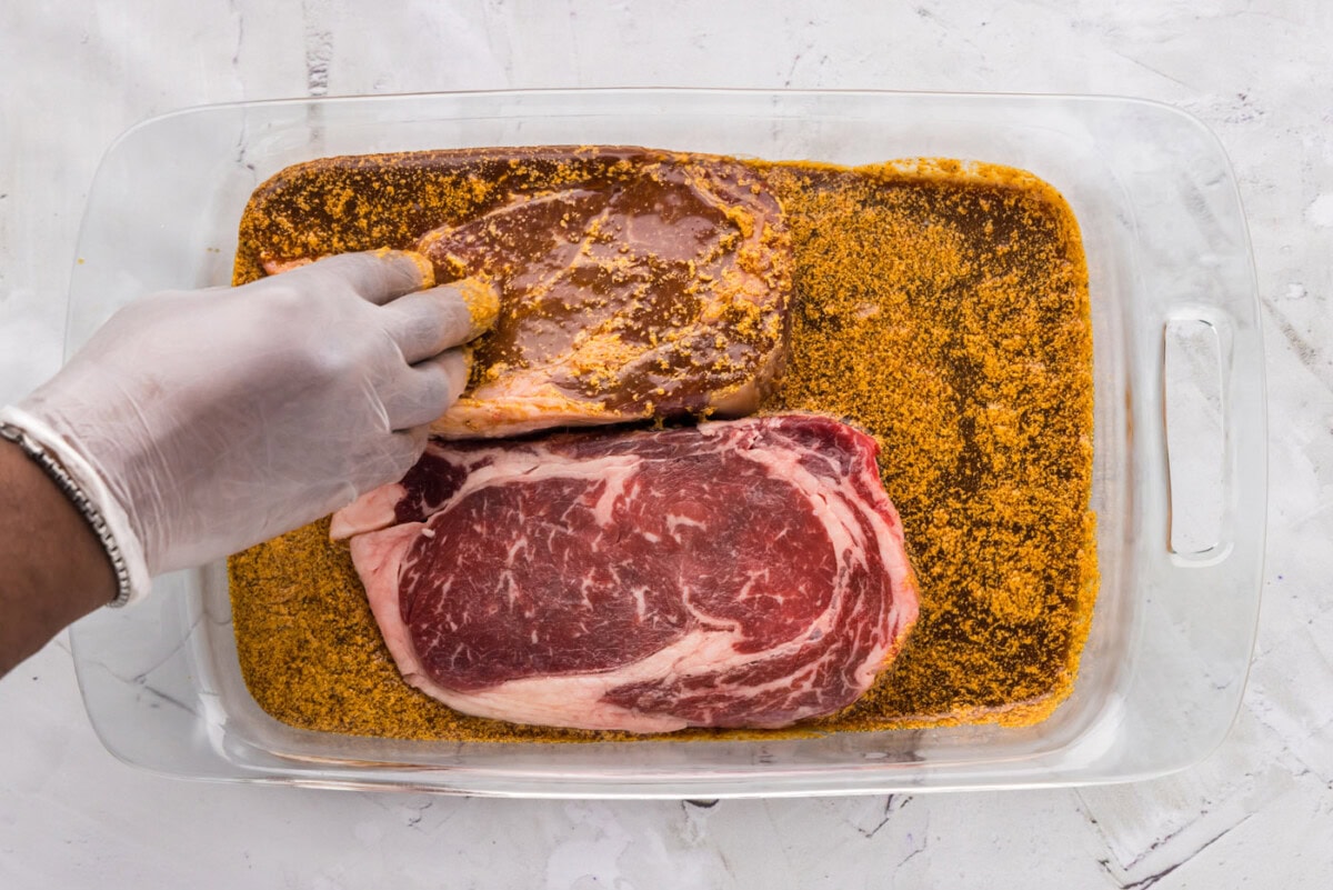 coating ribeye steak in marinade
