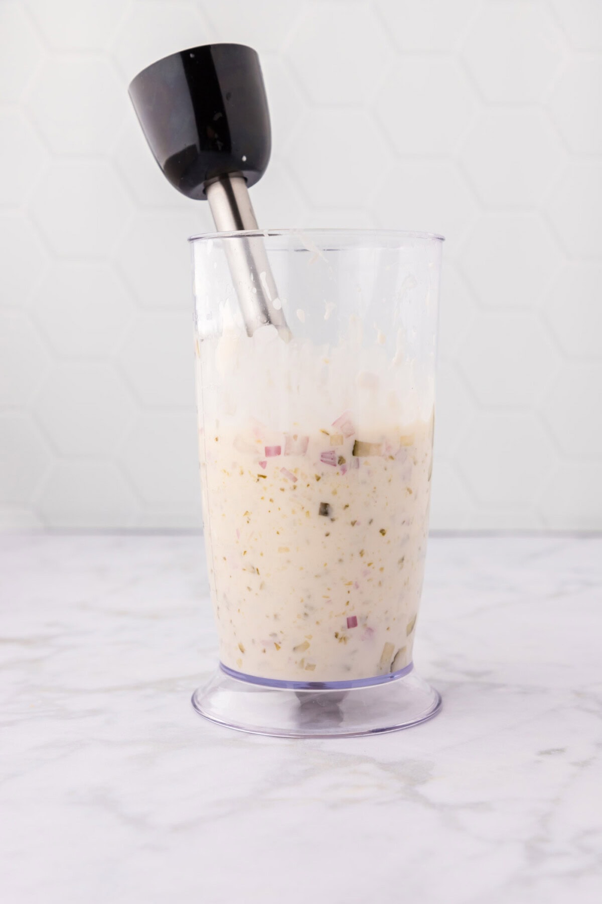 blending tartar sauce ingredients together