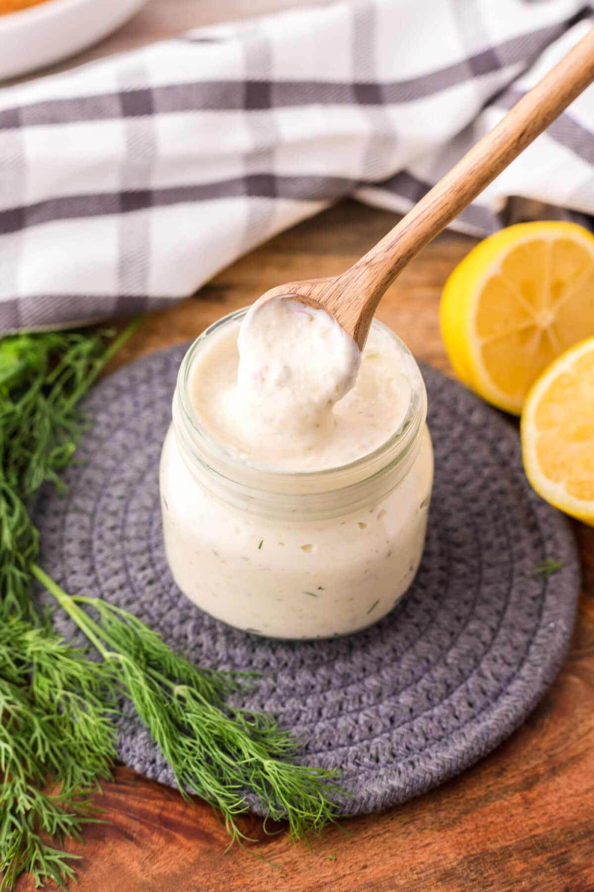 Spoonful of Tartar Sauce being taken out of the jar of Tartar Sauce