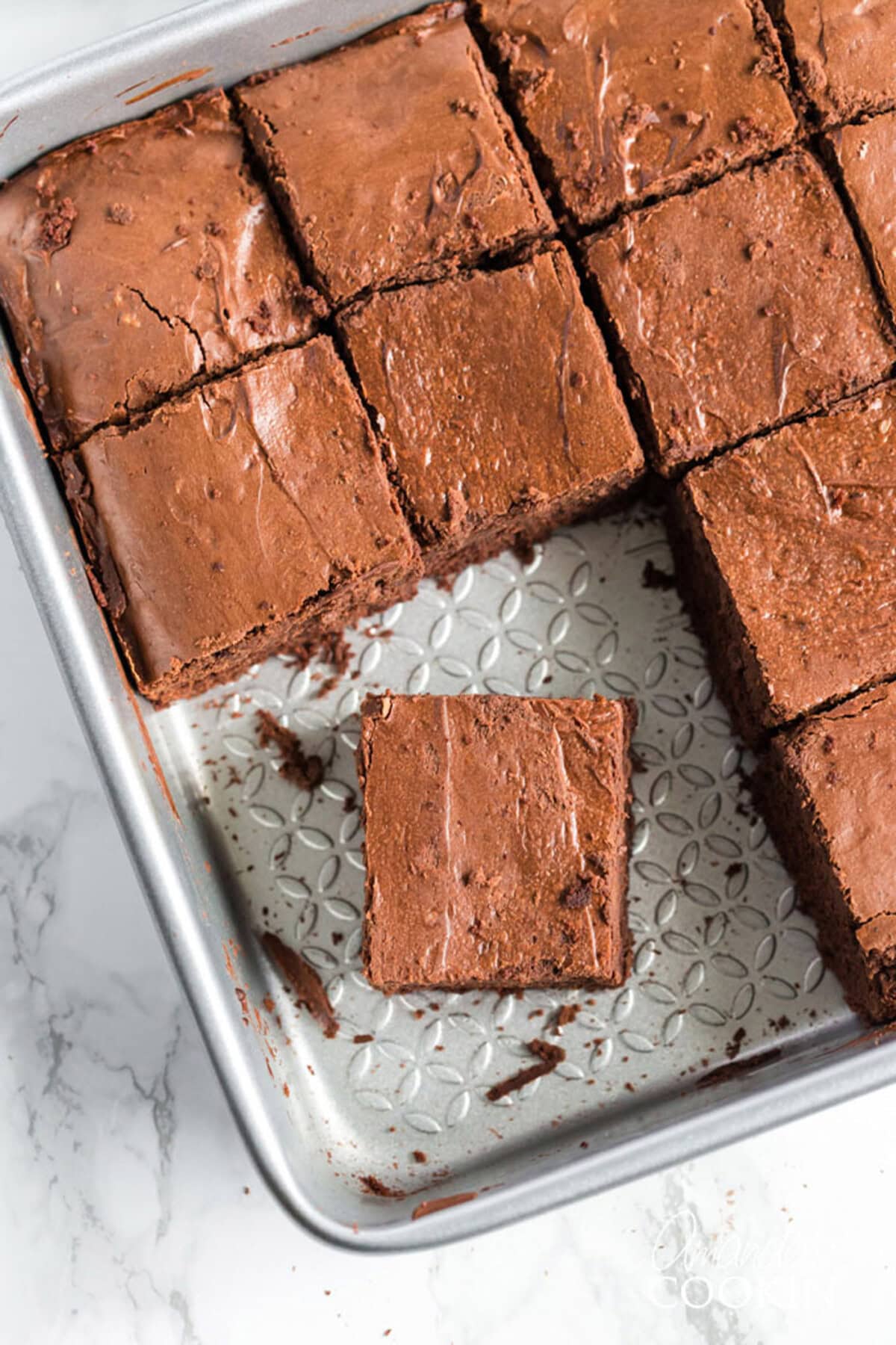 Pan of Chocolate Cheesecake Brownies with a few squares missing