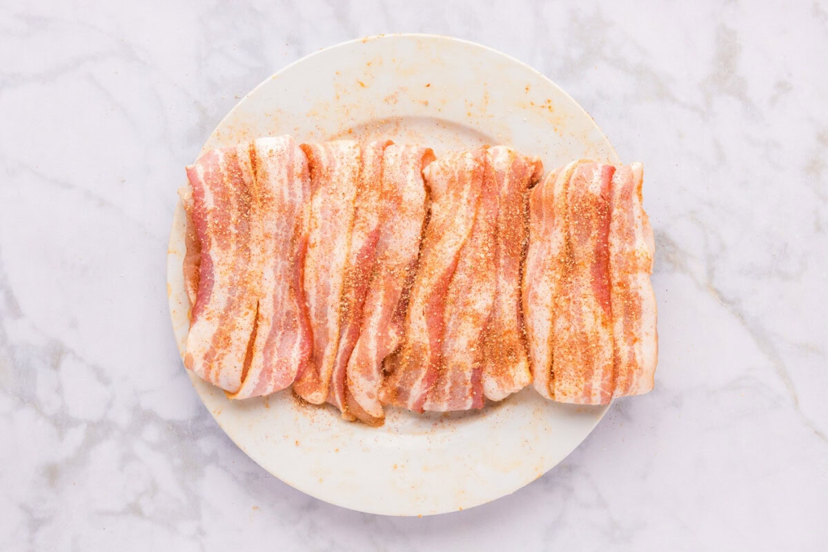 bacon wrapped chicken breasts on a plate