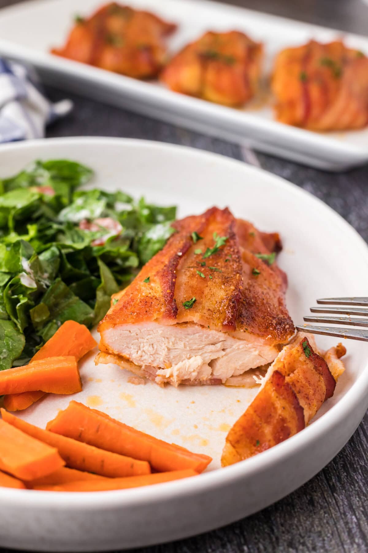 Bacon Wrapped Chicken on a plate cut open