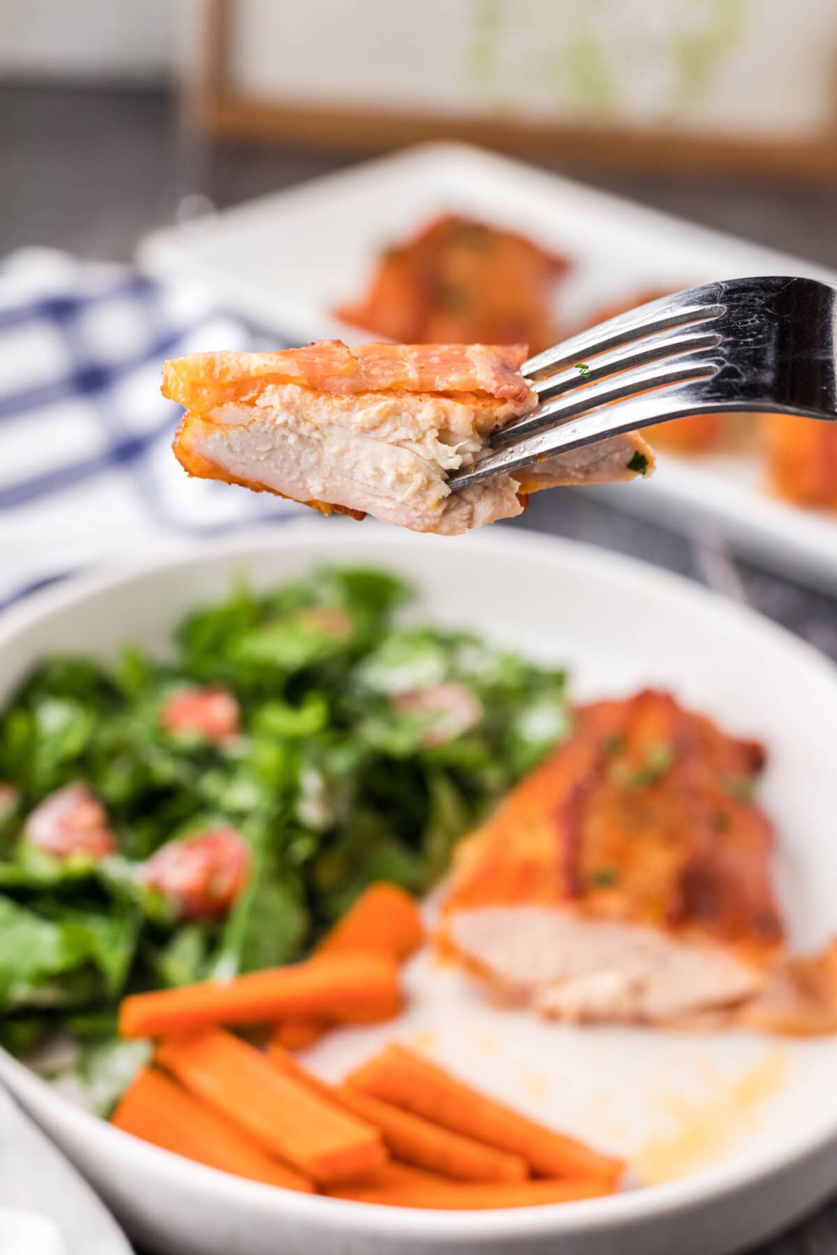Piece of Bacon Wrapped Chicken on a fork