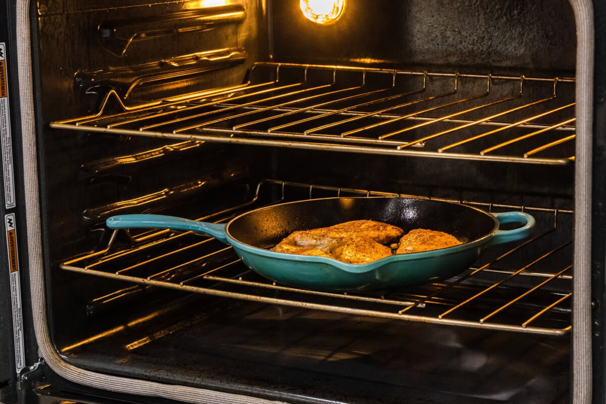 transferring seared chicken breasts to oven