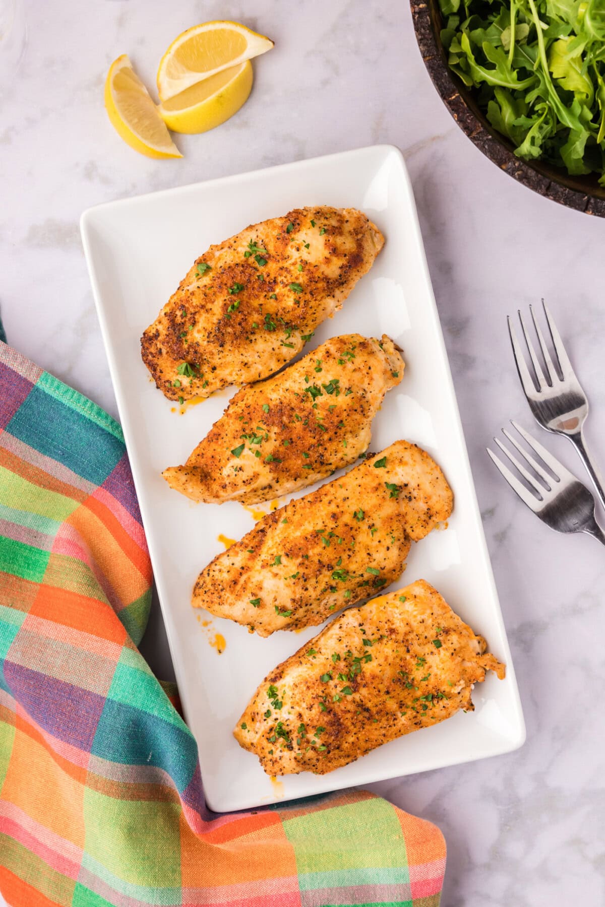 Blackened Chicken on a white serving platter